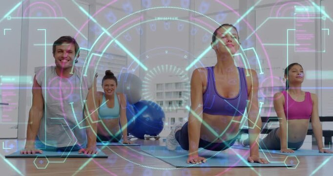 Leading central woman in purple top performing backbend in bright studio with HUD overlay