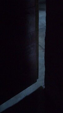 Suspenseful slow-motion reveal of a doorway entrance. High-tension visual for psychological thrillers, horror transitions, and investigative storytelling.