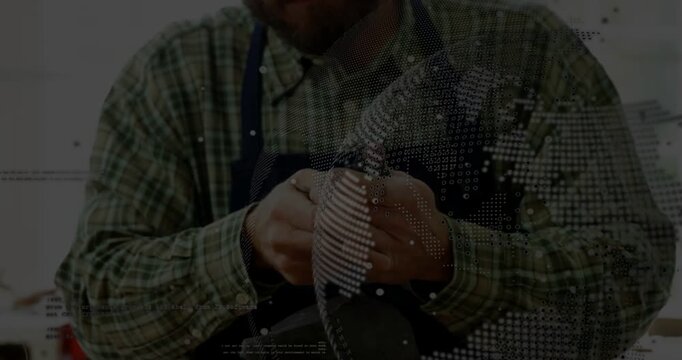 Male artisan picking up small part, inspecting near light, dotted overlay marking flaws for design