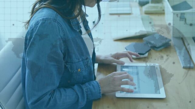 Vertical video: Designer tapping tablet and swiping, showing swatches on hex tiles for design
