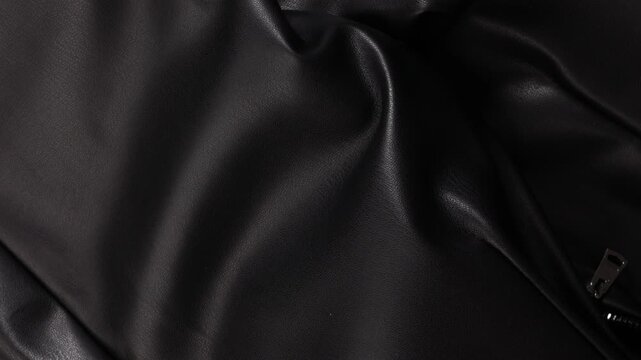 black leather or eco-leather fabric item of clothing