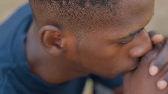 Black carpenter closeup contemplative hands resting chin, tight profile, warm skin tones, weary expression, soft natural light, cinematic shallow depth, authentic portrait of craftworker taking quiet