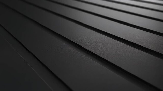 Diagonal view of textured black planks, creating a repeating pattern with subtle gradations