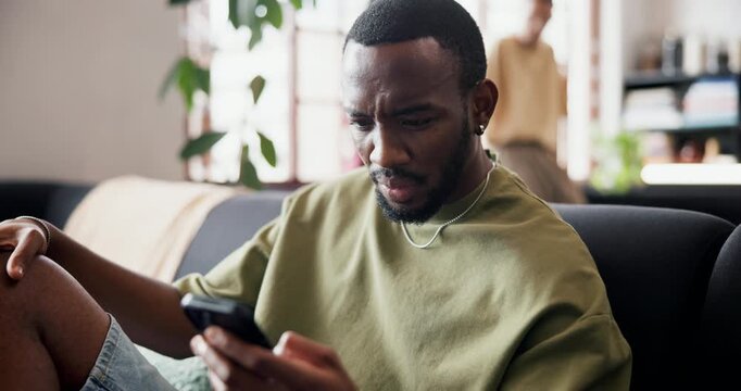 Confused, man and reading with phone at house for scam, phishing email and fraud notification. Angry, male person and mobile for fake news, suspicious payment and virus warning with hacking threat