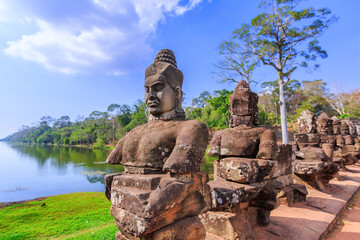 Naklejka premium Angkor Thom. Siem Reap, Cambodia. Heads of gods on the South Gate bridge.