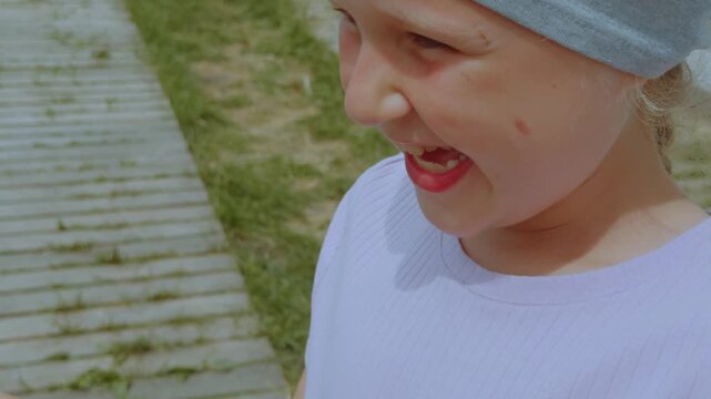 A girl feeds goats, goats in a zoo, a goat, goats in an aviary