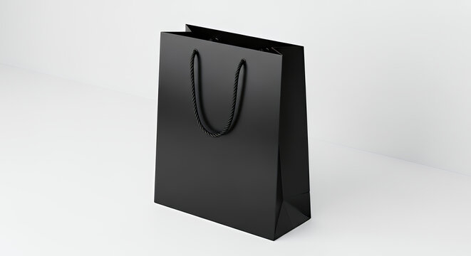 A sleek black paper shopping bag with black twisted rope handles sits on a white surface against a white background tote bag mockup mockup fabric bag tote blank canvas cloth design eco fashion cotton 