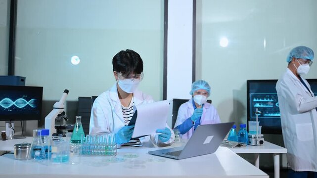 Medical scientists working in laboratory, biotechnology research, healthcare analysis, scientific experiment and innovation