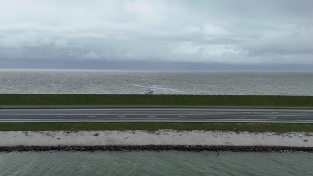 Static wide composition of dam between lake and sea