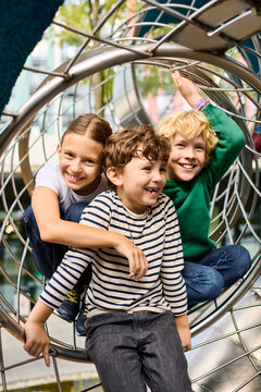 Childhood joy captured in autumn fun at the playground with friends