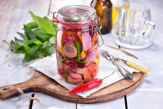 Drowning pickled sausages in brine