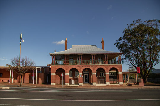 Historic red brick Wellington Post Office building with arched facade and upper balcony