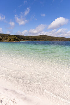 fresh water lake with clear water and white sand