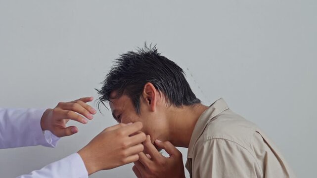 Professional doctor examining patient's ear during medical checkup
