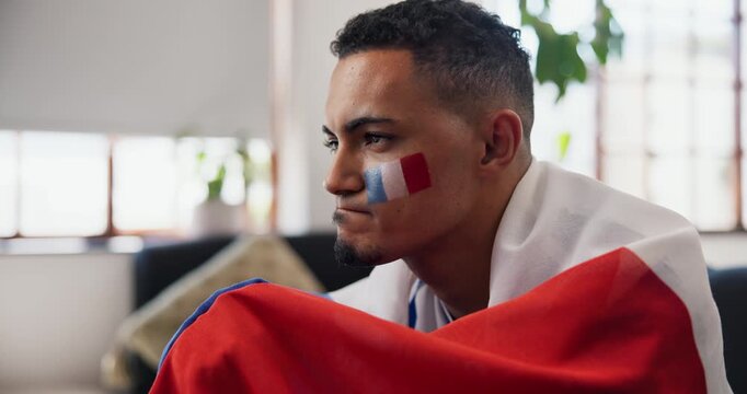 Disappointed, man and France flag in apartment for watching tv, football match and upset for game defeat. Frustrated, person and broadcast in home with soccer world cup fail, stress and sports loss.