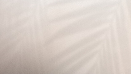 Obraz premium Blurred beige background with subtle leaf shadows and soft gradient texture