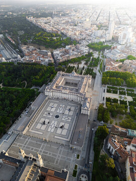 Aerial view of the Royal Palace of Madrid and Plaza de la Armeria with surrounding gardens and urban skyline Madrid, Community of Madrid, Spain.