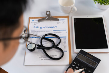 Fototapeta premium Healthcare Billing Statement with Stethoscope, Tablet and Calculator on Office Desk