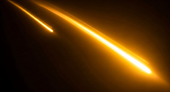 Two bright yellow lines shining on a dark background