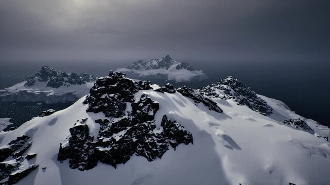 Icy mountain scene. Challenging snowy rugged terrain. Crisp icy summit with sharp ridges. Frozen mountain crest with dramatic shadows and textures