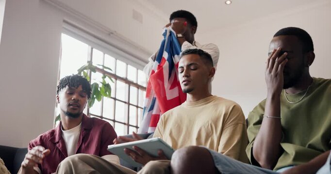 Fail, flag and tablet with men on sofa in home living room for loss, support or weekend. App, frustration and streaming service with British people in apartment together as disappointed sports fans