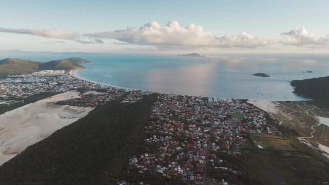 Aerial view of the town of Ingleses and its dunes during sunrise on the island of Santa Catarina. Florianopolis, Brazil