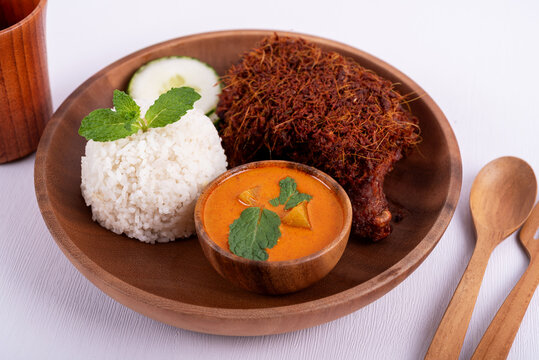 White rice and spice fried chicken or Nasi kukus ayam berempah Malaysian food