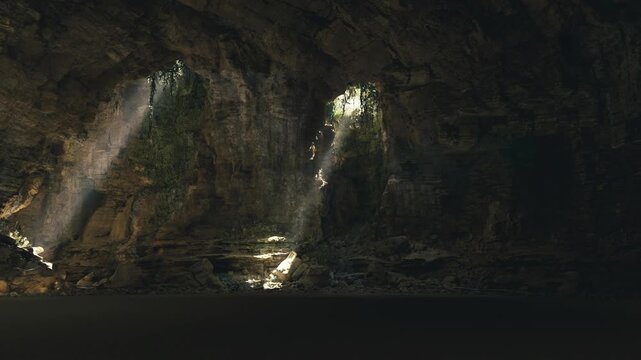 Vast vaulted cavern with shafts of light in Waitomo Glowworm Caves, monumental scale and textured ceiling create sense of ancient architecture, deep shadows