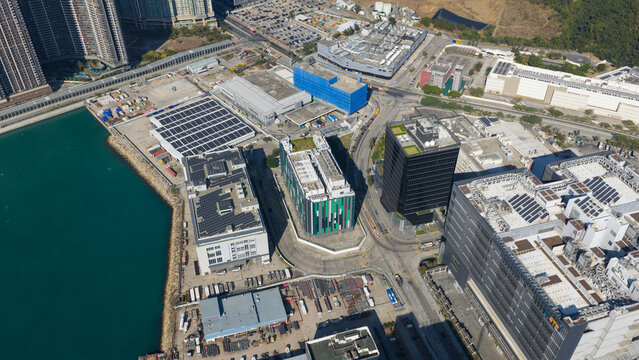 New Territories, Hong Kong - 14 February 2026: Aerial view of the Data Technology Hub DT Hub and modern industrial buildings with solar panels along the waterfront.