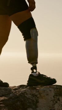 Athlete, sunset and prosthetic leg for hiking with fitness, workout and health with walk. Woman, nature and person with a disability outdoor for adventure, hobby and rehabilitation on mountain