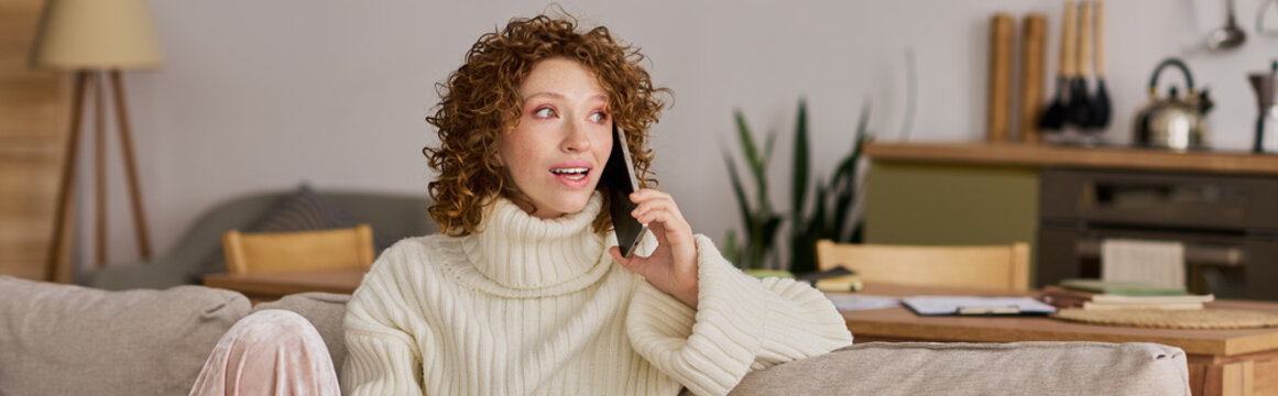 Curly-haired woman enjoys a spring afternoon chatting in her cozy apartment