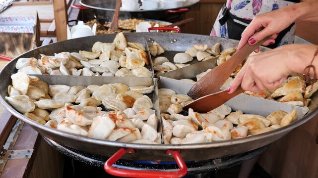 Frying Dumplings for sale. Street food.