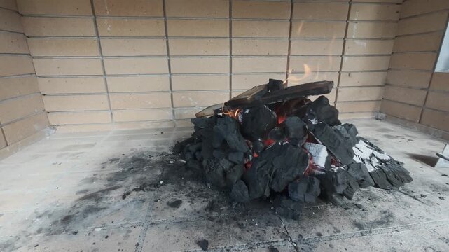 First Use Wood Oven Fire and Charcoal Preparation in Rural Greece Courtyard