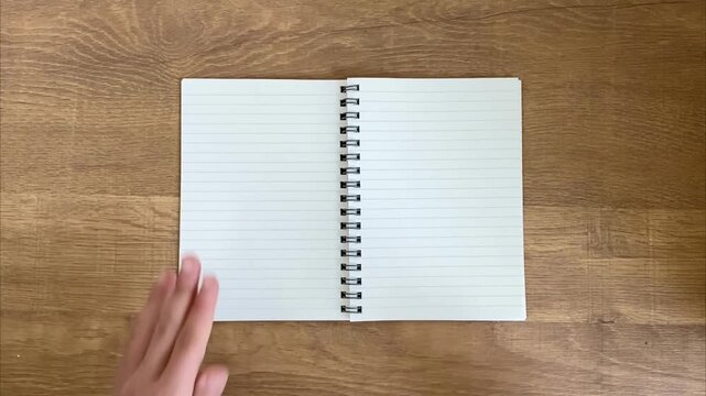 Child writing number 6 with purple pen in notebook slow motion
