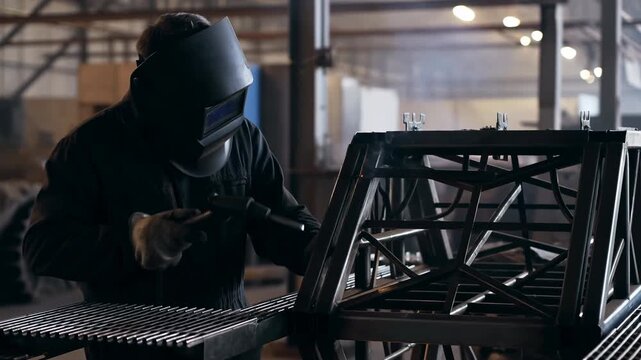 Worker Joining Steel With Torch. Industrial Worker Fusing Heavy Steel Components With Arc Torch