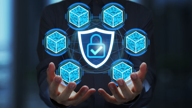 Blockchain security solution. Secure data encryption and protection for networks. Businessman holding shield hologram with check mark.