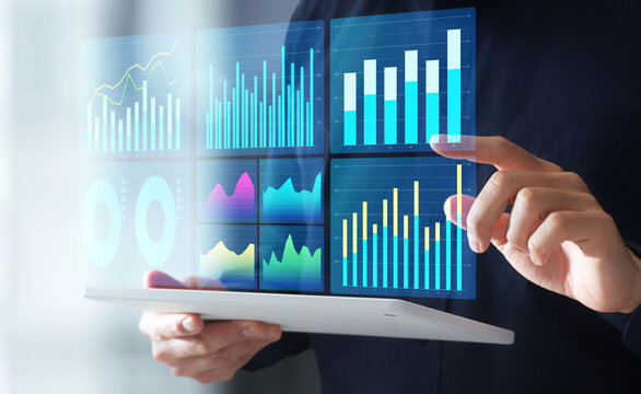 Business data analysis and analytics dashboard. Business intelligence reports with graphs and charts. Businessman using digital tablet.