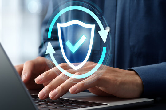 Security updates through firmware upgrades and patches. Continuous monitoring and update cycles. Businessman using laptop to fix vulnerabilities.