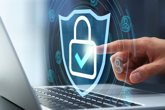 Endpoint security and data protection. Secure encrypted device with antivirus software and user authentication. Businessman touching padlock icon on laptop keyboard.
