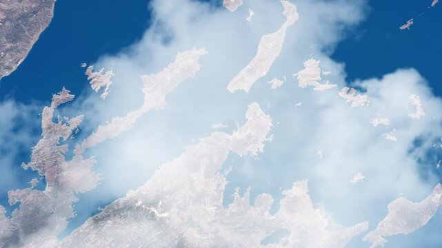 Flying over Dodecanese islands Aegean Sea Greece and Turkey satellite view from space with passing clouds based on Nasa imagery