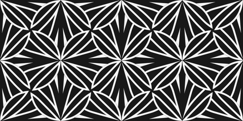 Fototapeta premium Symmetrical geometric pattern with sharp star-like shapes in black and white. Ideal for decorative backgrounds and contemporary design.