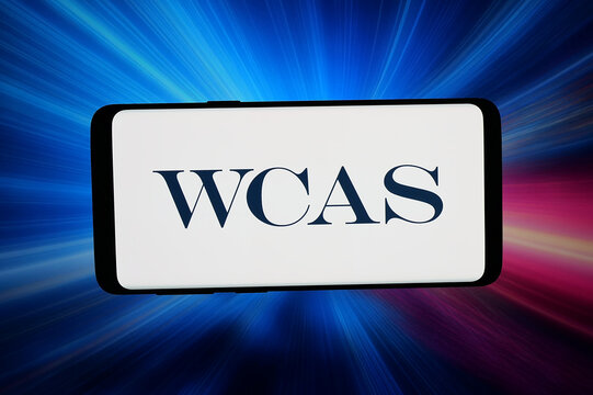 Stuttgart, Germany - 03-20-2026: In this photo illustration, the logo of Welsh, Carson, Anderson and Stowe (WCAS) is displayed on a smartphone in front of abstract background on computer screen.