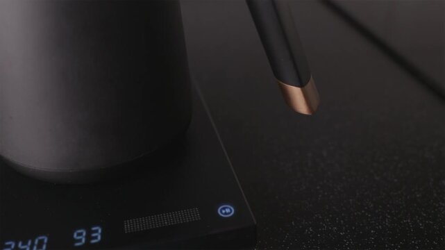 Professional kettle heating water to ninety-three degrees celsius