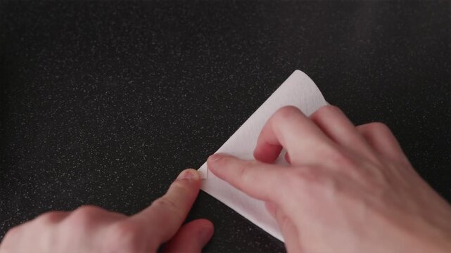 POV of preparing paper filter for V60 manual brewing