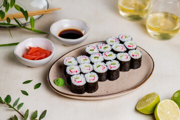 Maki sushi on a plate with ginger and soy sauce © carinne