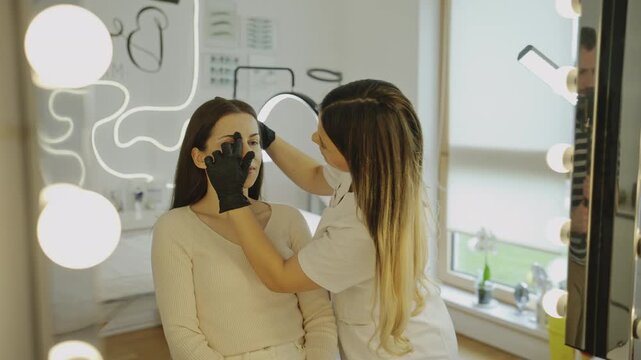 Eyebrow mapping and pre microblading consultation in beauty salon