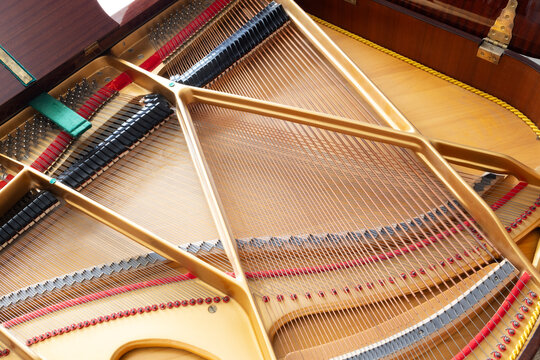 Grand piano strings close up abstract pattern musical instrument acoustic sound and design detail