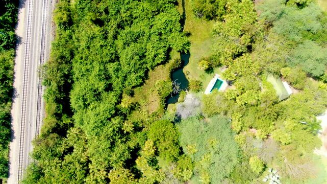 Estacion Termal Los Volcanes Alongside A River In Ci&eacute;naga, Magdalena, Colombia. Aerial Shot
