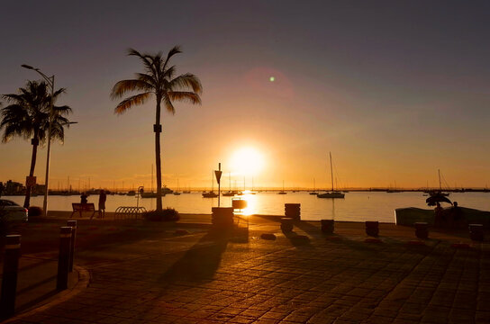 Sunset in the city of La Paz, Mexico, Baja California Sur stock photo images. Waterfront Malecon La Paz Mexico photo. Seaside Promenade images. Sunset in the marina photo