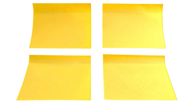 Four yellow square sticky notes, arranged in a 2x2 grid, on black